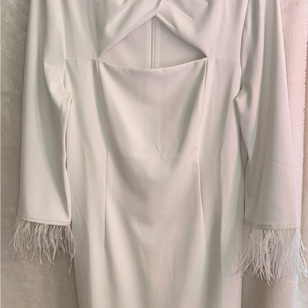 Adrianna Papell White dress with cut out at chest and feather details on sleeves